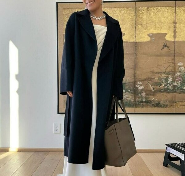 Comedian and actress Ali Wong dons a LILYSILK Double-faced Wool-blend Robe Coat before her appearance at the 81st Golden Globes Awards